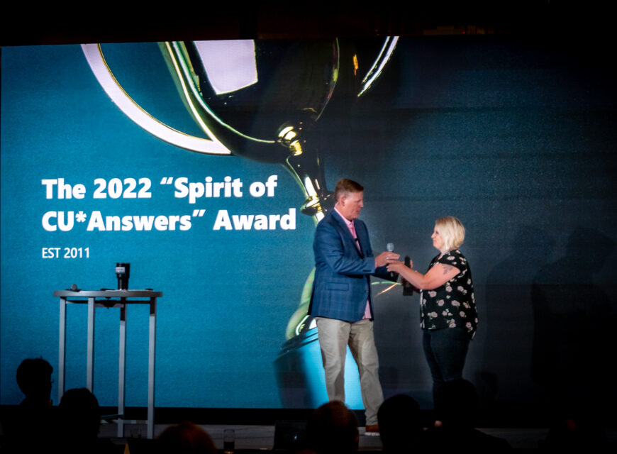CU*Answers CEO Geoff Johnson presents the "Spirit of CU*Answers" Award to Vizo Financial's Charnell Etzweiler.